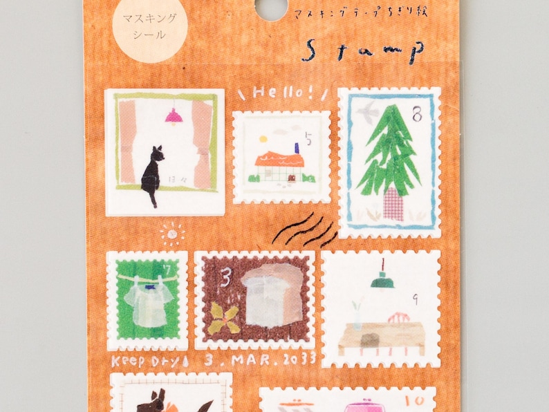 May include: A sheet of decorative masking tape featuring illustrations of a cat, a house, a tree, laundry, a lamp, and a table. The tape is labeled "Masking Tape" and "Stamp".