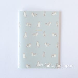 May include: A light blue notebook with a repeating pattern of gray and white cat illustrations. The word "notebook" is printed in gold. The bottom right corner has the text "fantastic japan".