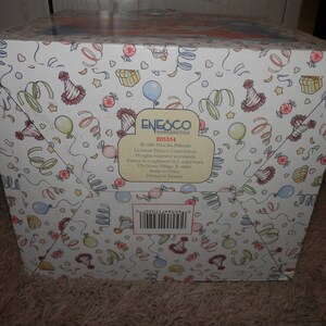 May include: A white box with a colorful party theme design. The box features a barcode, the text "ENESCO CORPORATION", and the number "205354".