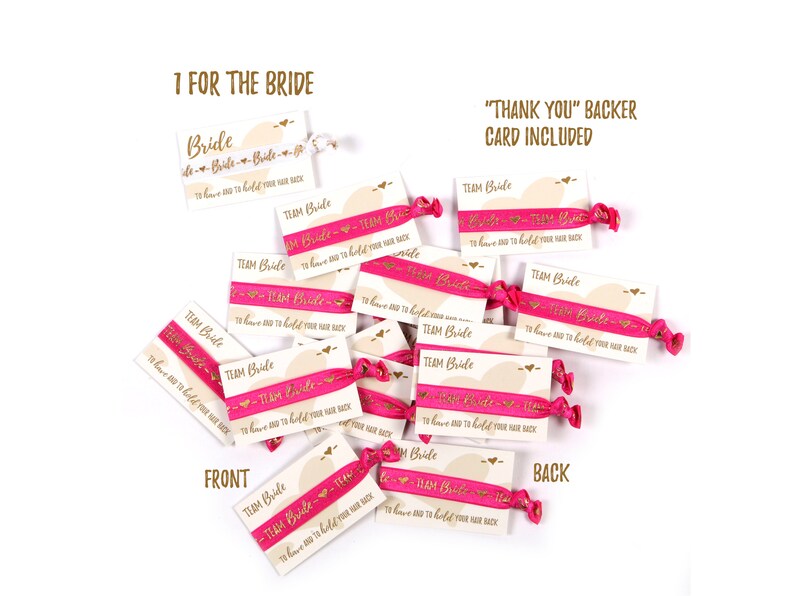 May include: A set of pink hair ties with gold lettering that says "Team Bride - To have and to hold your hair back". The hair ties are on a white background with a card that says "1 for the Bride" and "Thank You" Backer Card Included".