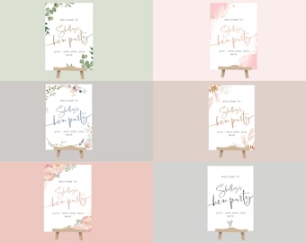 May include: Six different welcome signs for a hen party. Each sign features a different floral design and the text "Welcome to Shelley's hen party" with the date and location.
