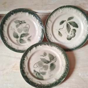 3 Old plates in dabbling and decorated with cherry and strawberry fruit
