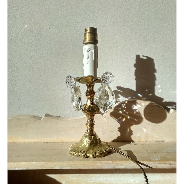 Old rococo chiseled bronze lamp, fake candle and crystal pendants