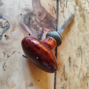 Pair of brown olive-shaped handles