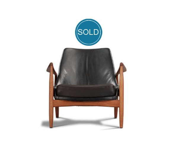 Ib Kofod Larsen s seal Chair in Teak and Black Leather