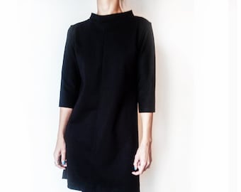 Vestido negro minimalista estilo Audrey Hepburn, elegante cuello alto, mangas 3/4