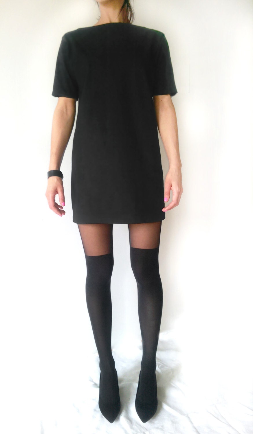 black t shirt dress with tights 11 Fashionable Ways to Style Black Tights With a Dress, According to Fashion Editors