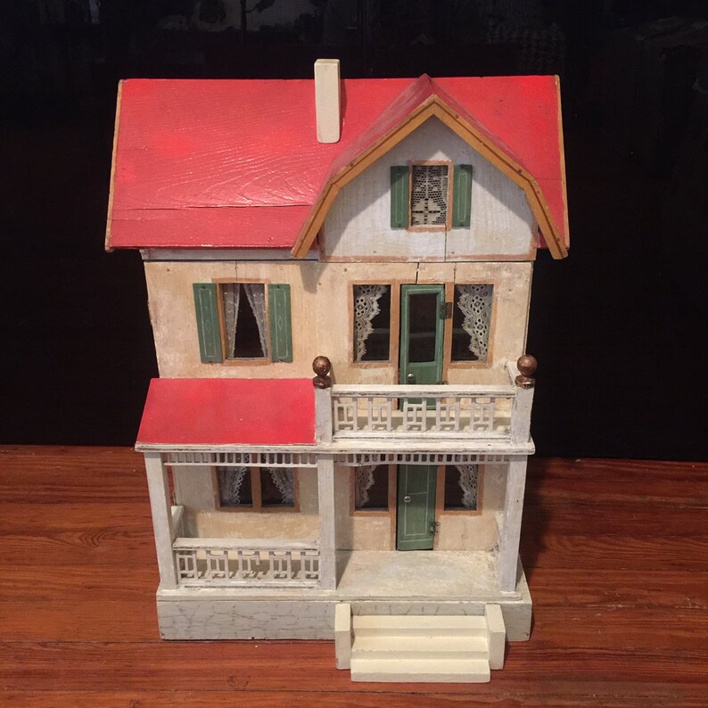 wooden dollhouse red roof