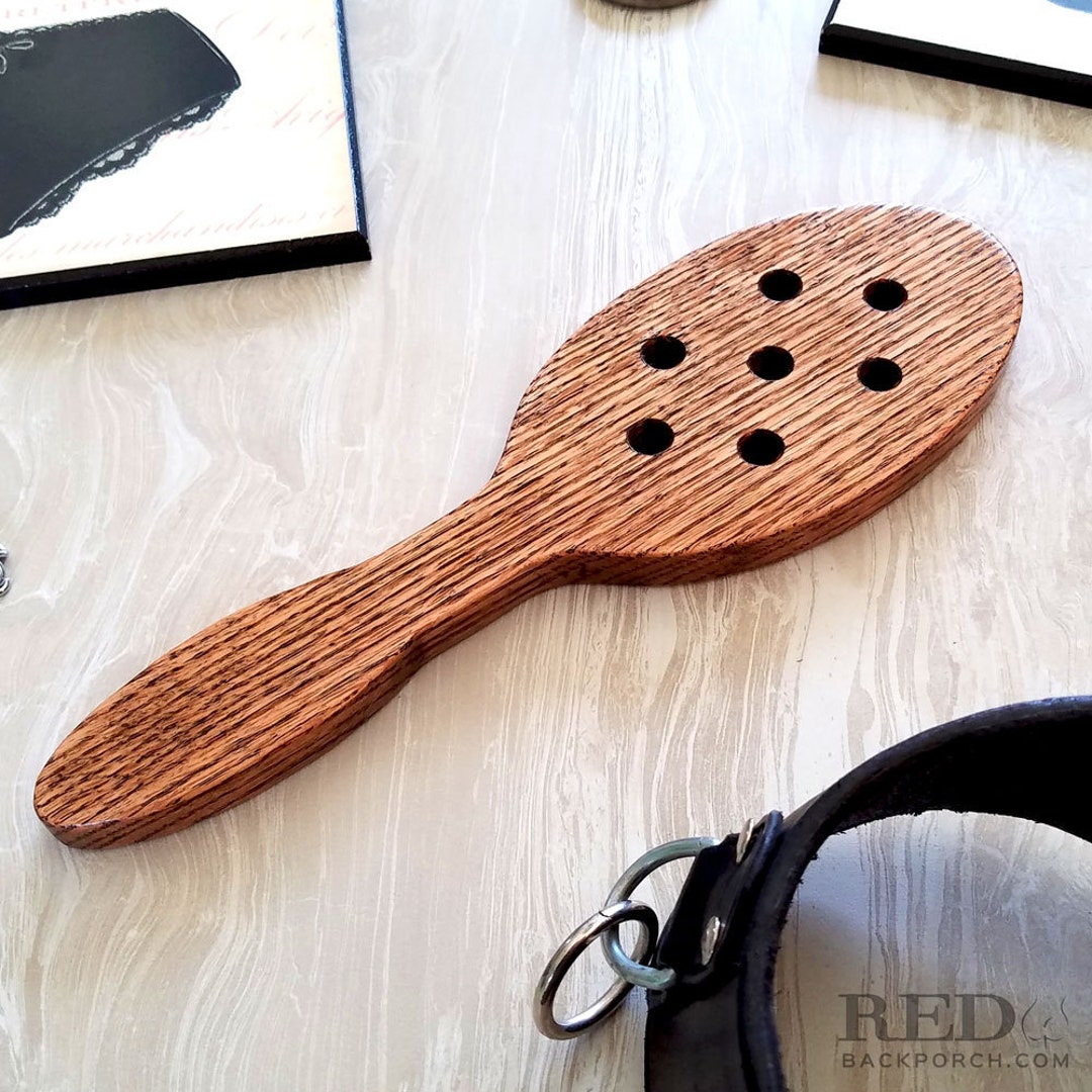 oak-hair-brush-spanking-paddle-with-holes-in-dark-walnut-stain-mature
