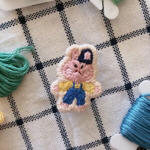 pink bunny wearing beanie embroidered patch pin