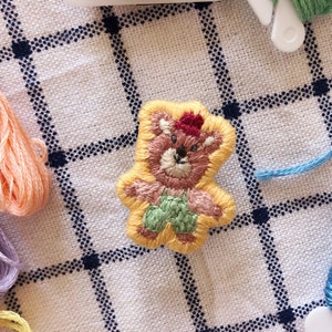 bear wearing red hat embroidered patch pin