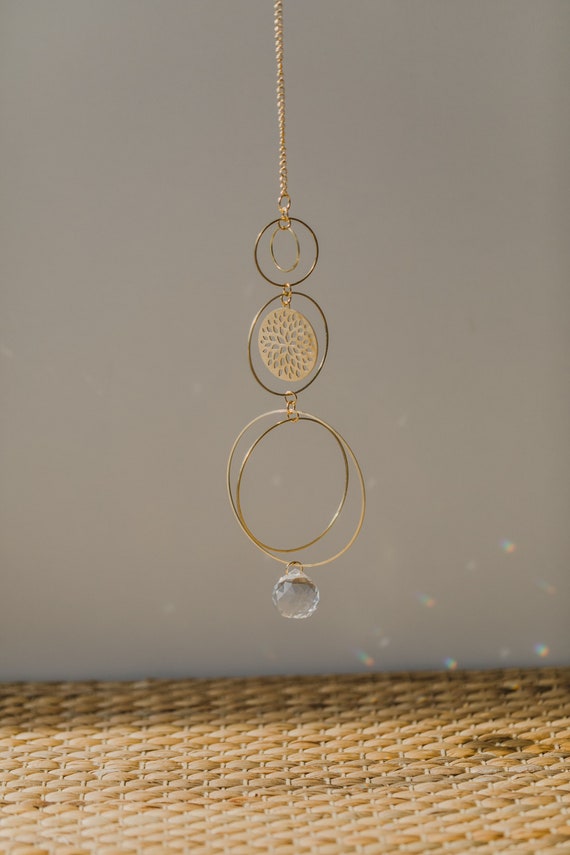 golden round sun catcher with a floral design // boho sun catcher // brass mobile // brass wall hanging // glas crystal rainbow maker