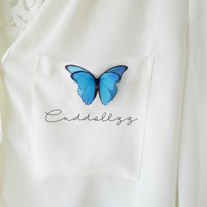 Blaue Schmetterlingsbrosche. Morpho Blaue Seidenschmetterlinge.
