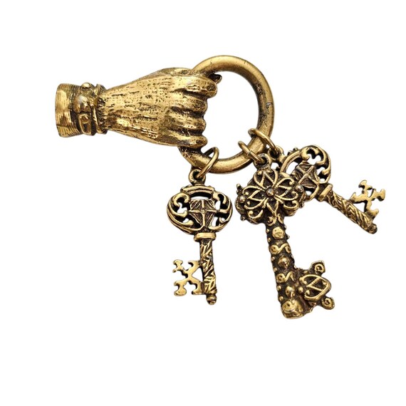 Jeanne Gold Tone Hand Holding Key Charms Brooch, Signed