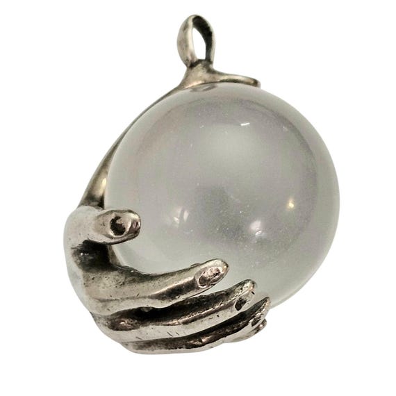Sterling Silver Pool Of Light Pendant Hand Holding Quartz Crystal