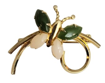May include: A gold butterfly brooch featuring green and white stones. The butterfly has a delicate design with intricate details. The brooch is a beautiful piece of jewellery that would make a great gift.