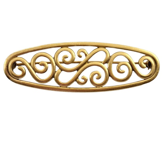 Yves Saint Laurent Goldtone Oval Open Scroll Broo… - image 1