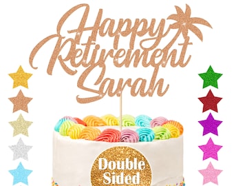 May include: Gold glitter cake topper with the text "Happy Retirement Sarah" and a palm tree design. The topper is on a white cake with rainbow frosting and sprinkles. The text "Double Sided Glitter" is on a gold circle.
