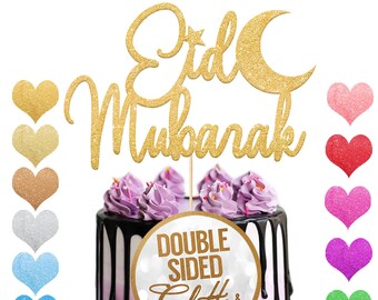 Può includere: Topper per torta in glitter dorato con le parole "Eid Mubarak" e una mezzaluna. Il topper è su una torta viola e nera con un adesivo rotondo che dice "Glitter su entrambi i lati".