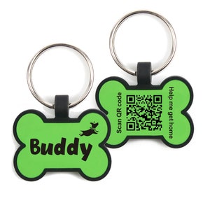 May include: Green bone-shaped dog tag with a silver key ring. The tag has the word "Buddy" and a small dog silhouette. The back of the tag has a QR code and the text "Scan QR code" and "Help me get home".