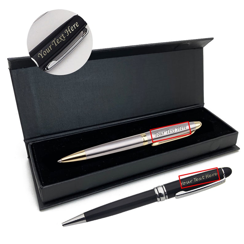 May include: Two silver and black pens with gold accents in a black box. The pens are engraved with the text "Your Text Here".