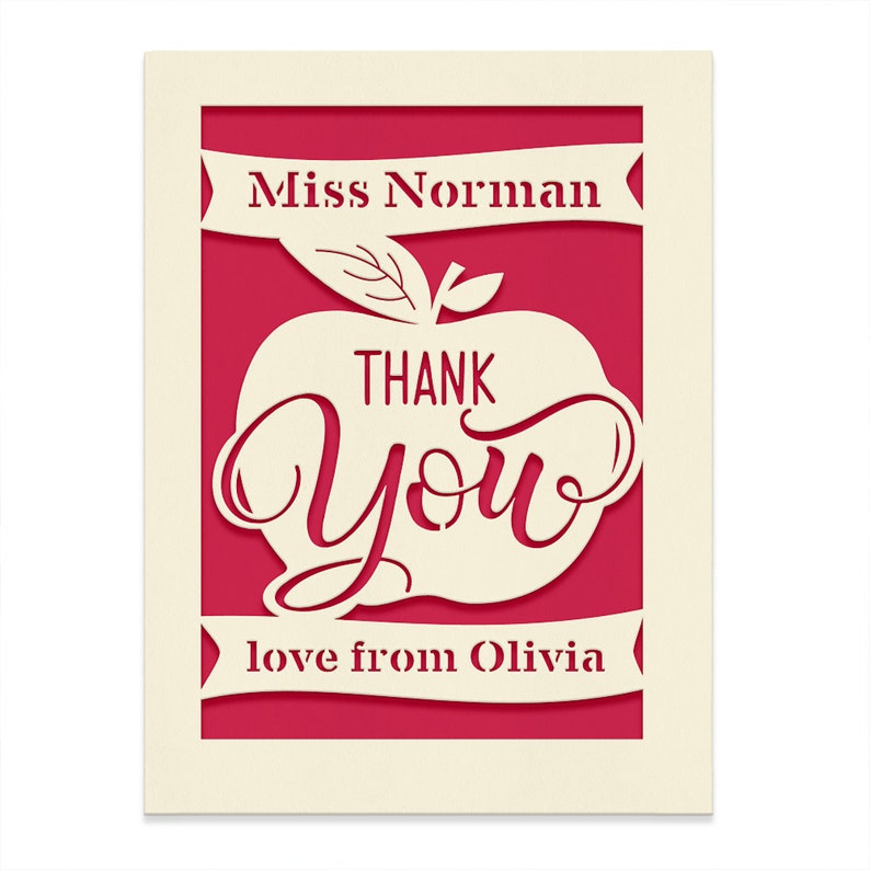 May include: A red card with a white apple cut out. The apple has the words "THANK YOU" inside. The card says "Miss Norman" at the top and "love from Olivia" at the bottom.