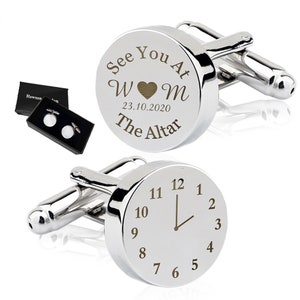 May include: Silver cufflinks with a circular design. One cufflink has the text "See You At The Altar" with the date "23.10.2020" and the initials "W&hearts;M". The other cufflink has a clock face with the hour hand pointing to 12.