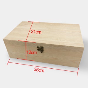 May include: A natural wood box with a hinged lid and a brass latch. The box measures 35 inches long, 12 inches wide, and 21 inches high.