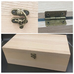 May include: A wooden box with a hinged lid and a brass latch. The box is made of light wood and has a natural finish. The lid is closed and the latch is in the closed position.