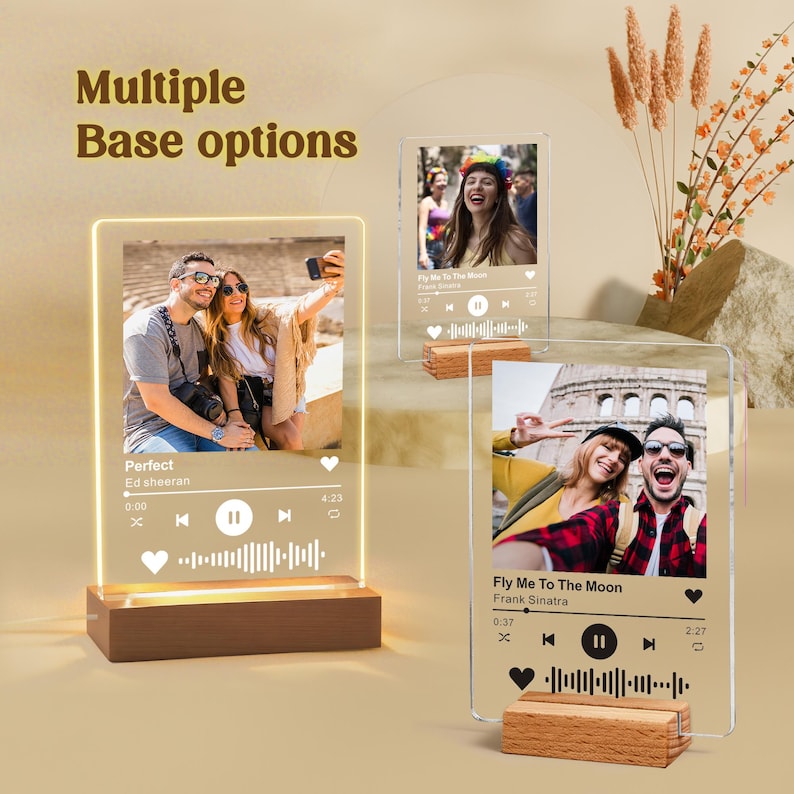 May include: Acrylic music plaque with a wooden base, featuring a photo and song details. The plaque displays the song "Perfect" by Ed Sheeran. The image shows multiple base options. The plaque is illuminated with a warm light.
