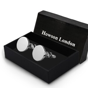 May include: A pair of silver cufflinks in a black box with the text "Howson London" on the lid.
