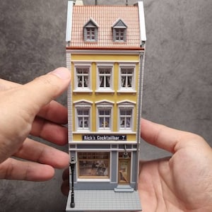 Completely assembled miniature model house for decorating a small town scale H0 1:87 for book nook miniature people or as a collection