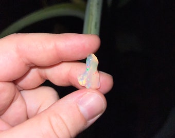 Tumbled Ethiopian opal with rainbow flash