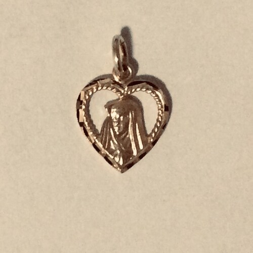 10KT yellow gold Virgin Mary heart pendant. online