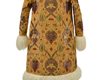 May include: A long, gold-colored coat with a white fur collar and cuffs. The coat is patterned with a floral design in shades of green, red, and gold.
