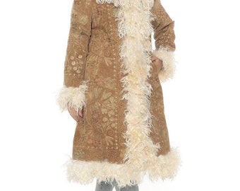 May include: A long brown suede coat with a white faux fur collar and trim. The coat has a floral pattern and is lined with white faux fur.