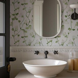 Charming wallpaper featuring green leaf vines and white sweet pea blooms.