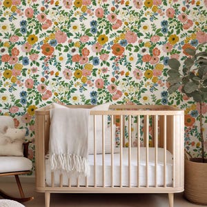 Cheerful summer wallpaper with a vivid rose garden design, available in easy-to-apply peel and stick or classic traditional materials.