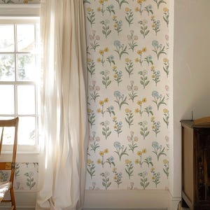 May include: Wallpaper featuring a repeating pattern of small, delicate flowers in shades of yellow, light blue, and soft pink on a white background, with green stems and leaves arranged in a vertical, organized layout across the wall surface.