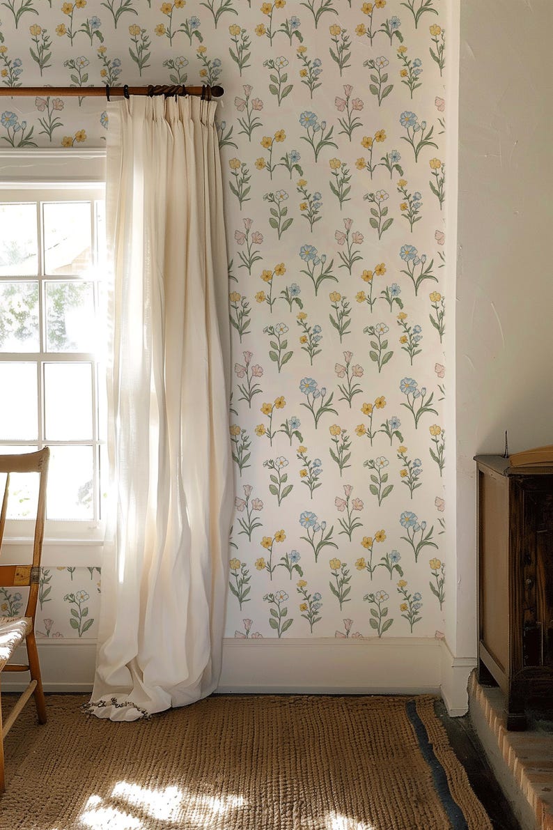 May include: Wallpaper featuring a repeating pattern of small, delicate flowers in shades of yellow, light blue, and soft pink on a white background, with green stems and leaves arranged in a vertical, organized layout across the wall surface.