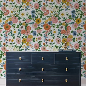 Eye-catching floral wallpaper with a bright rose pattern, available in peel and stick and traditional options for a stylish summer look.