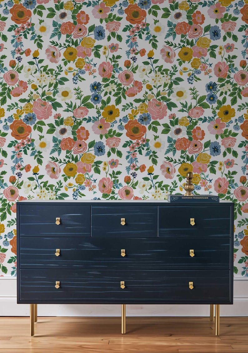 Eye-catching floral wallpaper with a bright rose pattern, available in peel and stick and traditional options for a stylish summer look.