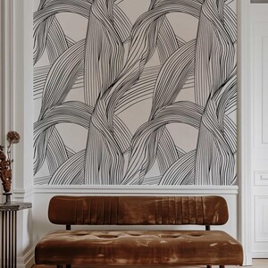 Monochrome wall covering with large black lines.