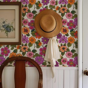 Traditional wallpaper with a lively 70s flower pattern in electric hues.