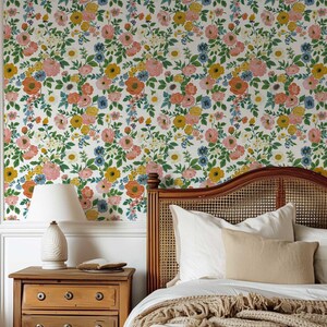 Vibrant floral wallpaper showcasing a bright rose garden pattern, offering a fresh and lively look for any room in your home.