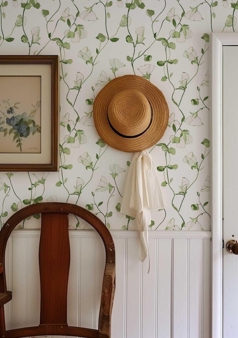 Elegant green leaf and sweet pea bloom pattern wallpaper available in peel and stick and traditional options.
