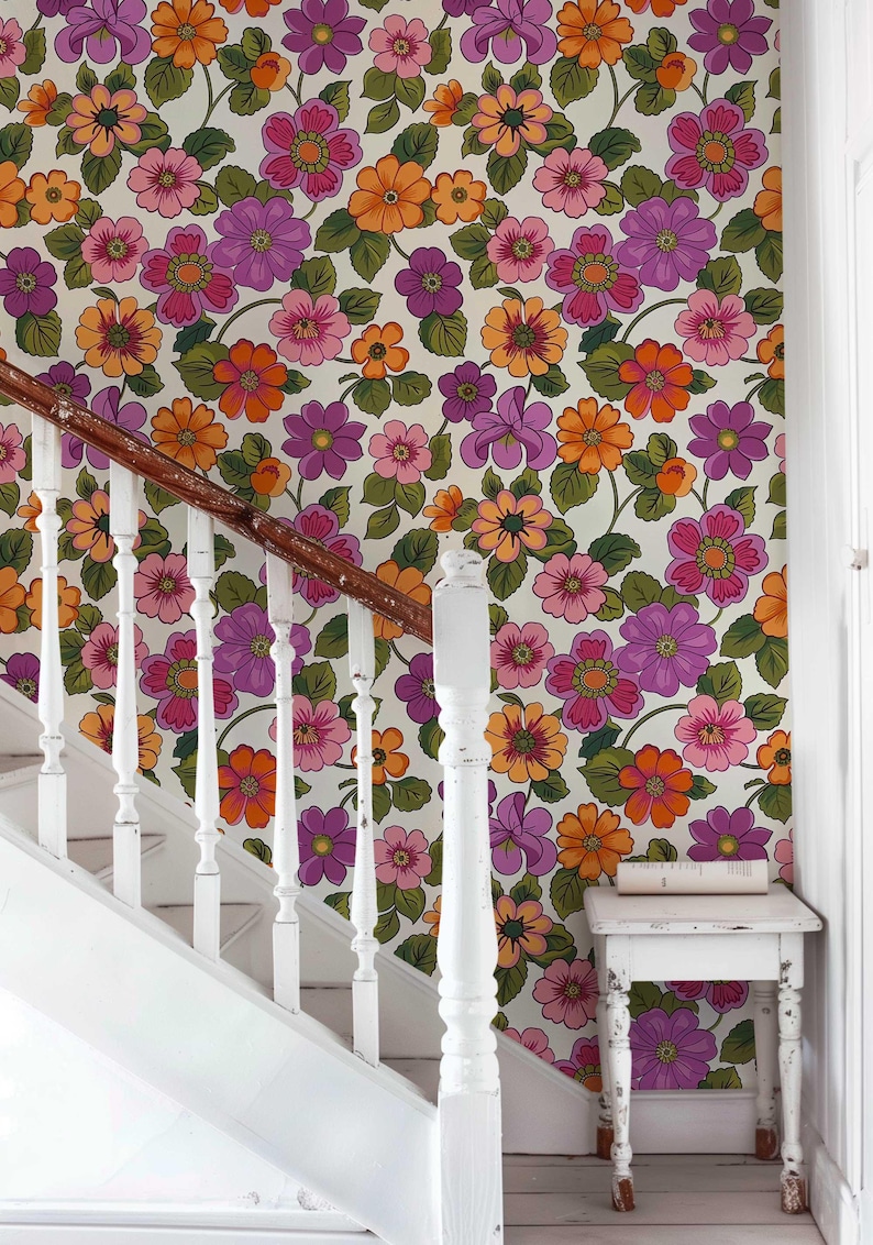 Retro floral wallpaper featuring an explosion of vibrant 70s-style flowers.