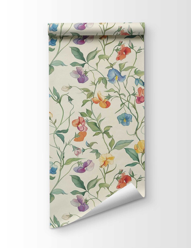 May include: A roll of wallpaper featuring a botanical pattern on a cream background. The design displays climbing vines with green leaves and multi-colored sweet pea flowers in shades of purple, blue, orange, red, and yellow, with one corner curled.