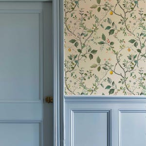 Our Chinoiserie Peel and Stick Wall Mural brings a soft, floral touch to your space. Featuring branches, leaves, and small fruits in light pastel colors, this removable wallpaper is perfect for boho nursery accent wall decor