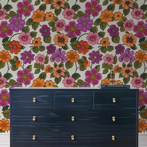 Peel and stick wallpaper showcasing a colorful and funky 70s-style flower design.
